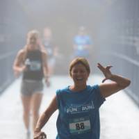 A participant holding "anchor up" while crossing the Little Mac bridge